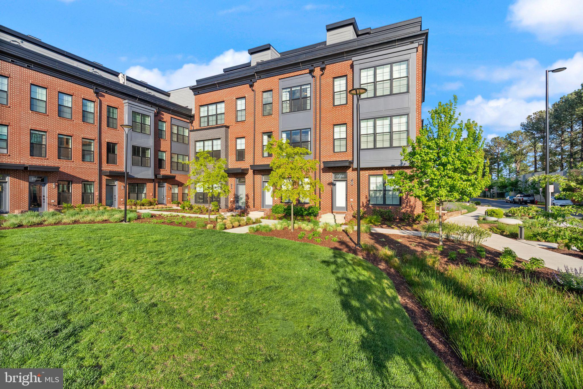 11258 Faraday Park Drive Reston, VA 20190 - Photo 43 of 44 a view of a building with a yard