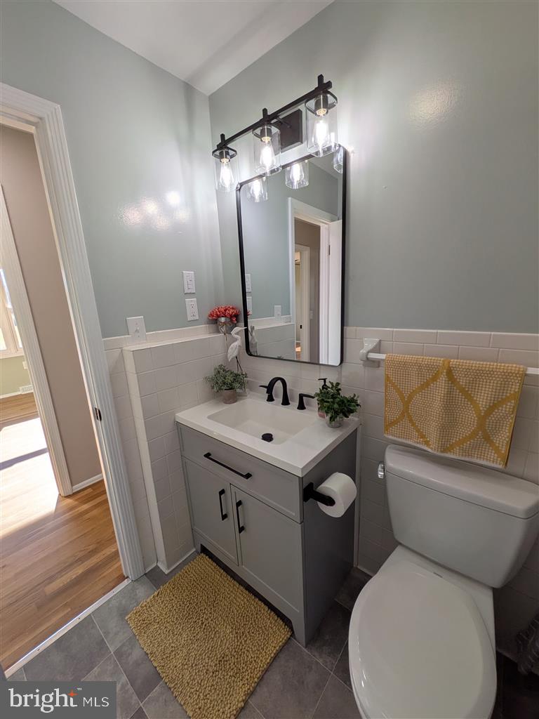 7183 Oak Drive Reva, VA 22735 - Photo 6 of 6 a bathroom with a toilet sink and mirror