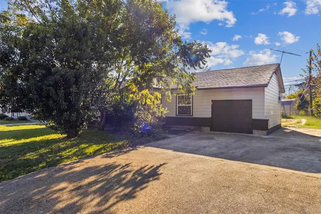 a view of backyard with swimming pool and outdoor seating