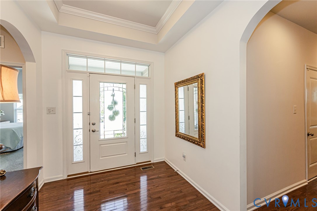 7435 Wicks Road Williamsburg, VA 23188 - Photo 11 of 82 Foyer featuring a white paneled entry door with de