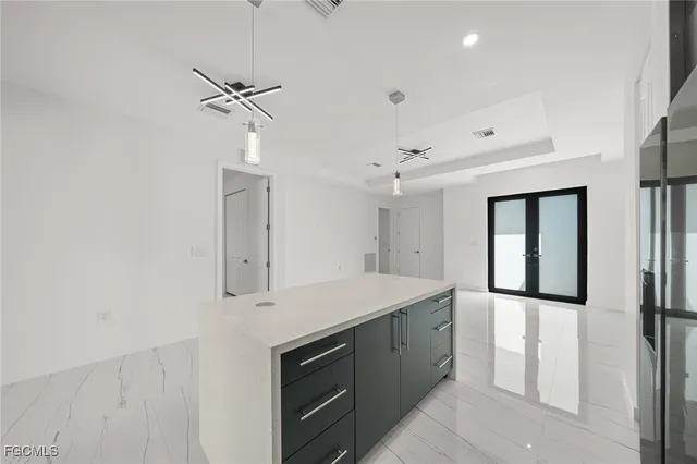 a kitchen with stainless steel appliances a refrigerator and a sink