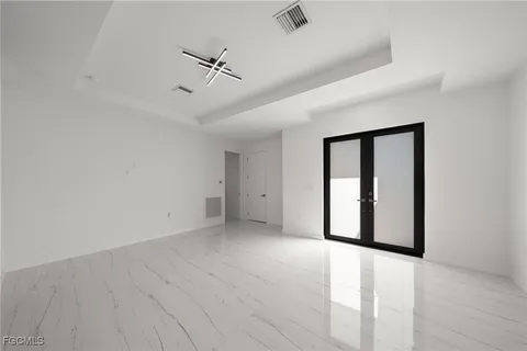 a large kitchen with kitchen island a large counter top and stainless steel appliances