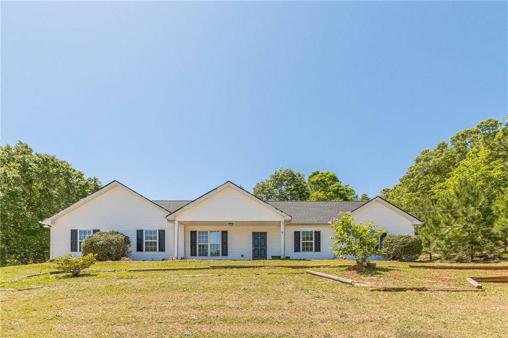 a front view of a house with a yard
