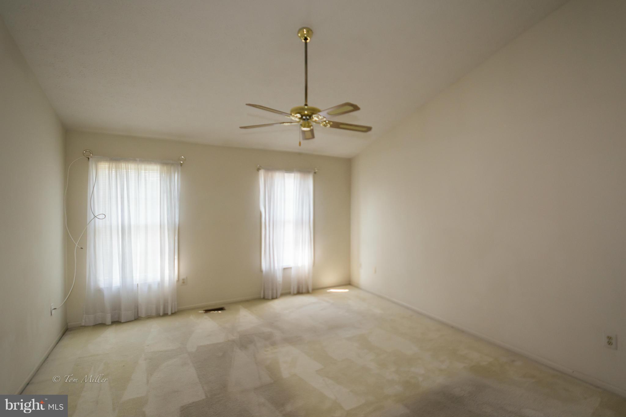 910 Metfield Road Baltimore, MD 21286 - Photo 14 of 22 a view of an empty room with a window