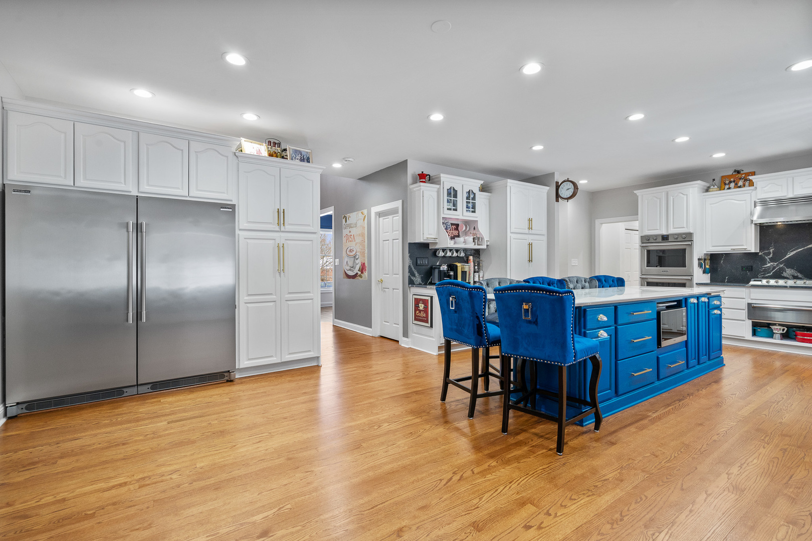 19427 Hunter Trail Mokena, IL 60448 - Photo 2 of 72 a kitchen with stainless steel appliances kitchen island granite countertop a refrigerator a stove a sink dishwasher with a dining table and chairs