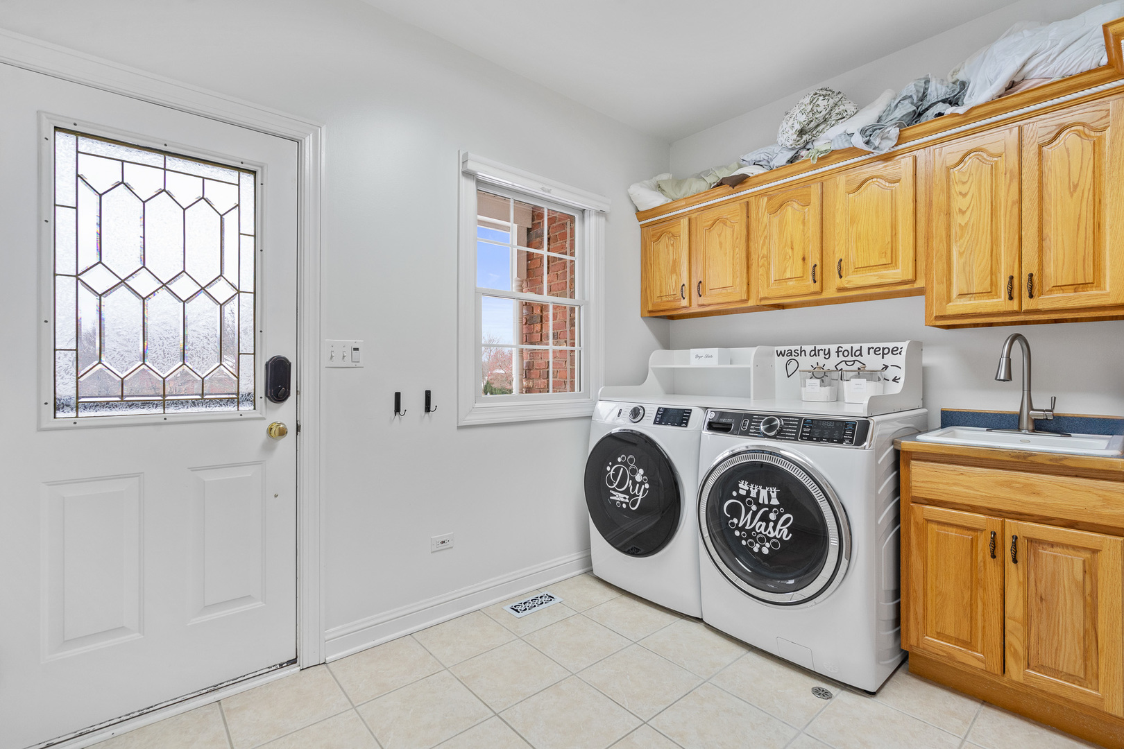 19427 Hunter Trail Mokena, IL 60448 - Photo 24 of 72 a utility room with fridge washer and dryer