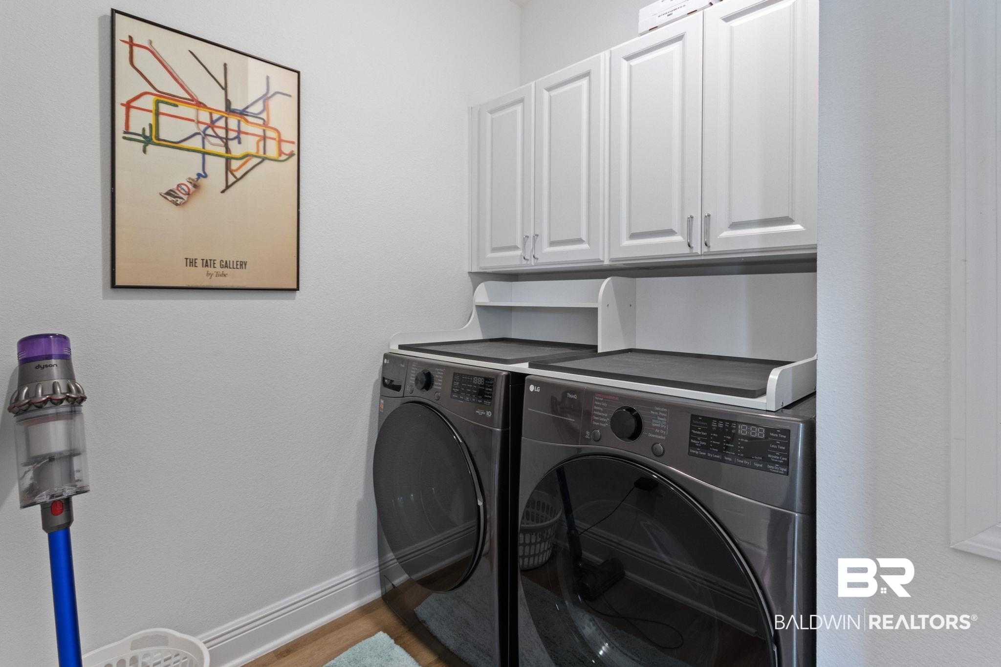12919 Torrent Road Fairhope, AL 36532 - Photo 42 of 74 Laundry area with cabinet space and washing machine and dryer