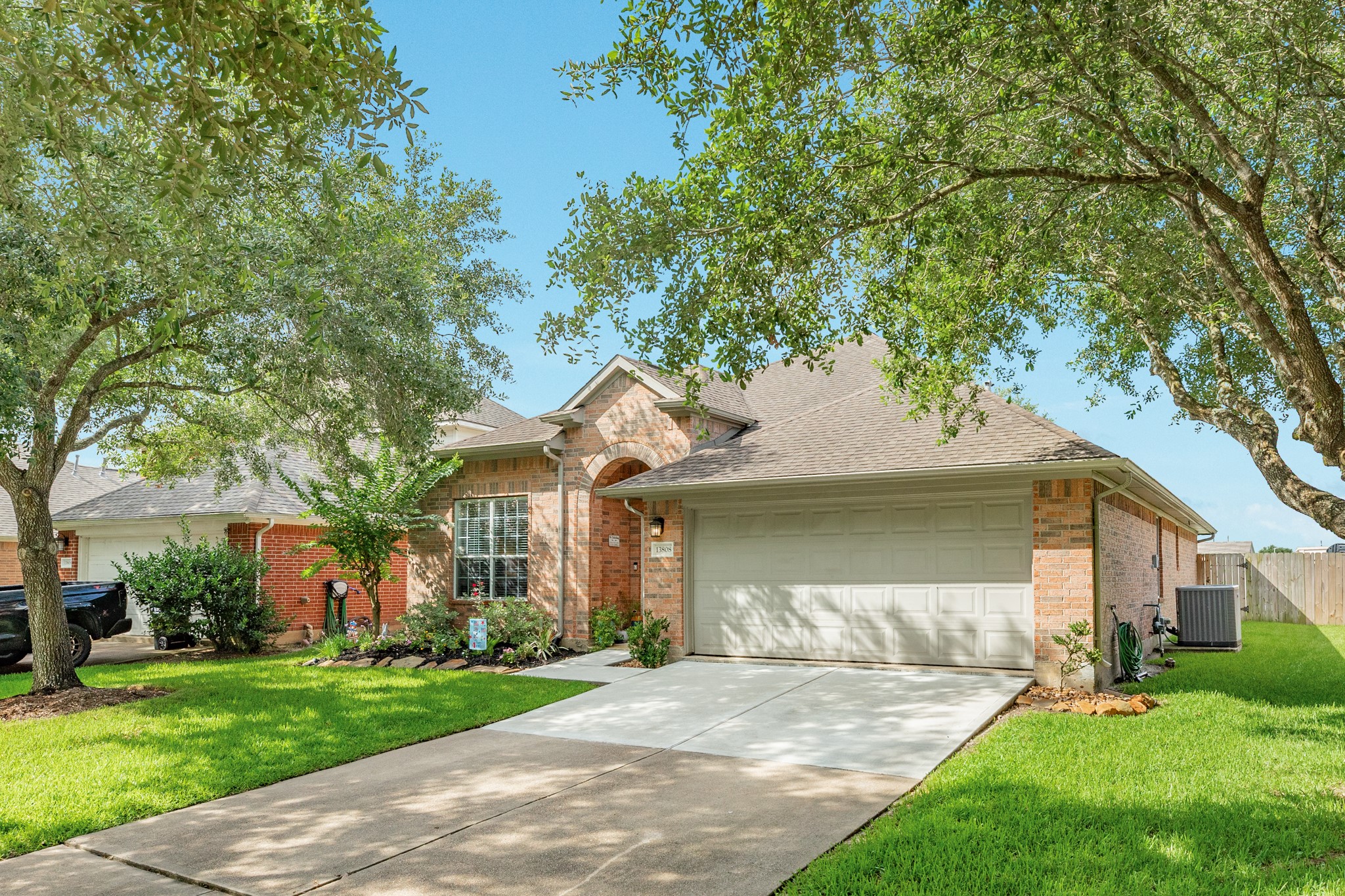 13808 Stark Bridge Lane Rosharon, TX 77583 - Photo 28 of 39 Front view of the home showing the professionally replaced concrete driveway and sidewalk section completed following the recent foundation repair.