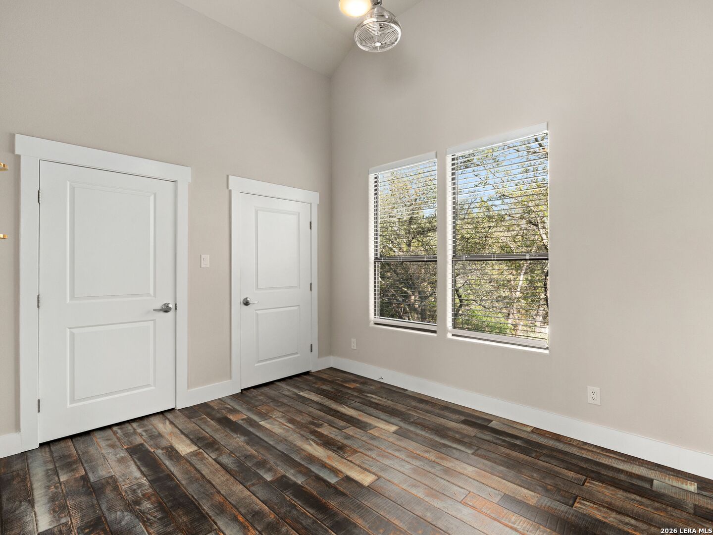 1146 Victoria Avenue Spring Branch, TX 78070 - Photo 38 of 89 a view of an empty room with wooden floor and a window