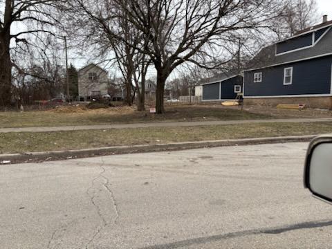 5617 South Perry Avenue Chicago, IL 60621 - Photo 4 of 4 a view of a house with a yard
