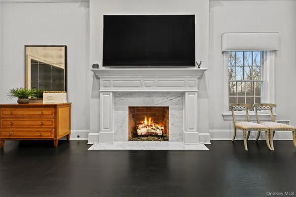 a bedroom with a bed and a fireplace