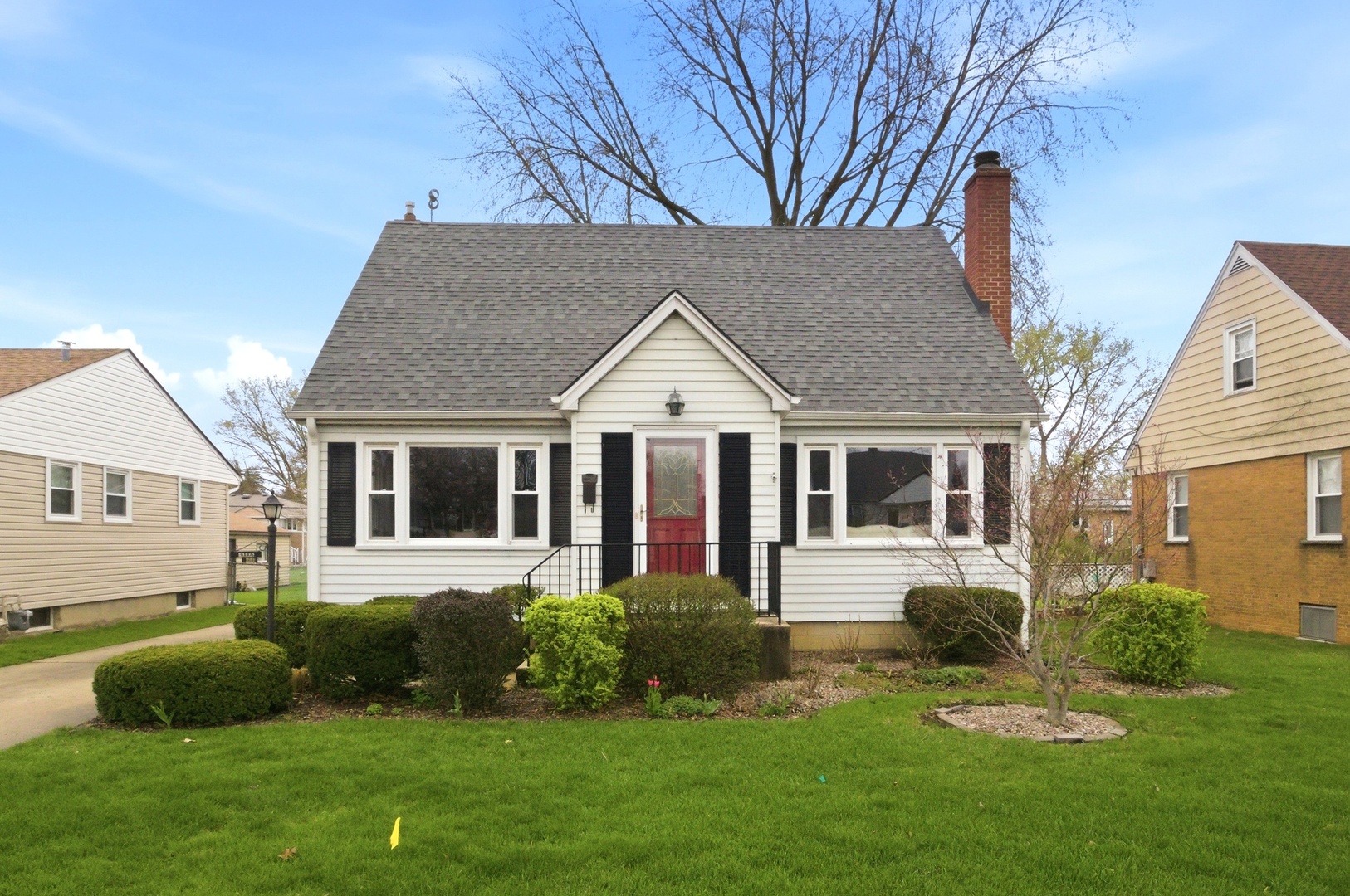 221 South Michigan Avenue Addison, IL 60101 - Photo 1 of 25 a front view of a house with a yard and garage