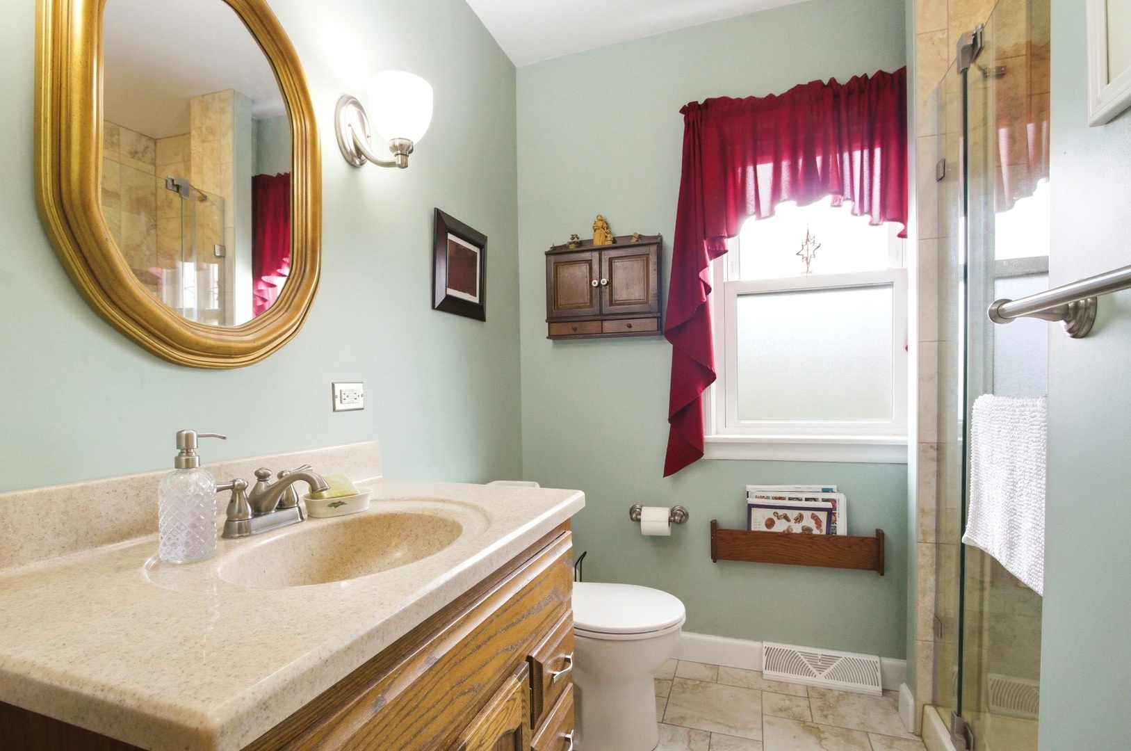 221 South Michigan Avenue Addison, IL 60101 - Photo 12 of 25 a bathroom with a sink a mirror a toilet and a mirror