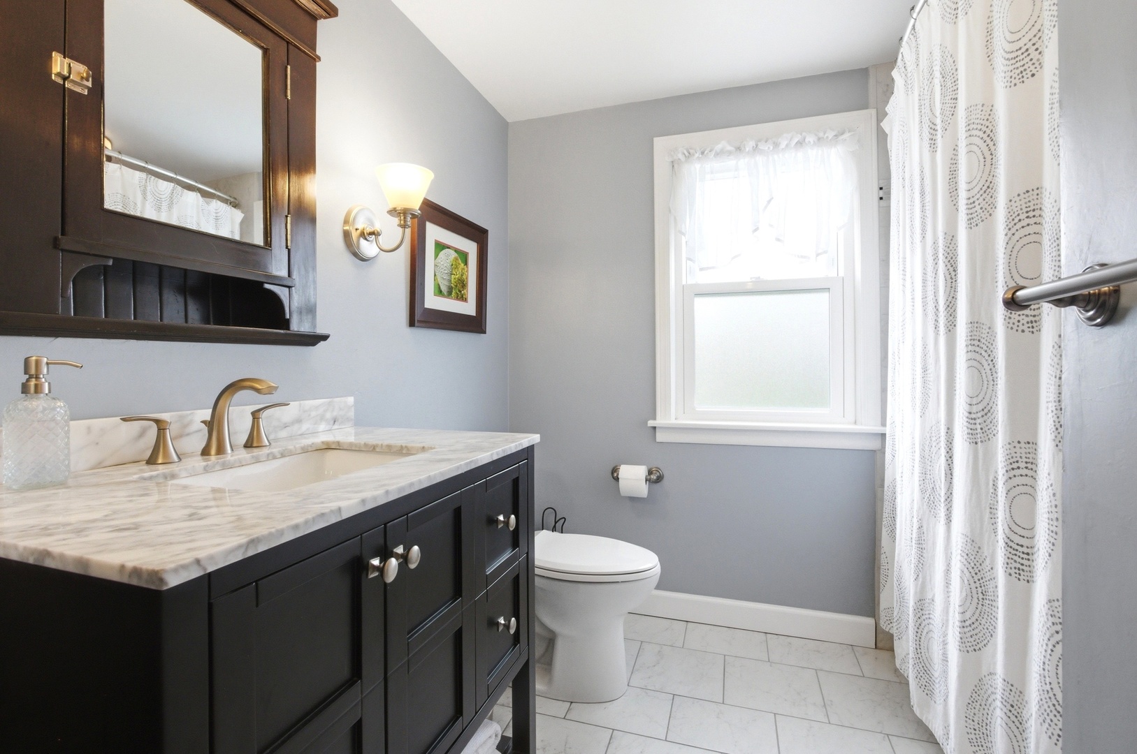 221 South Michigan Avenue Addison, IL 60101 - Photo 16 of 25 a bathroom with a granite countertop sink a toilet and a mirror