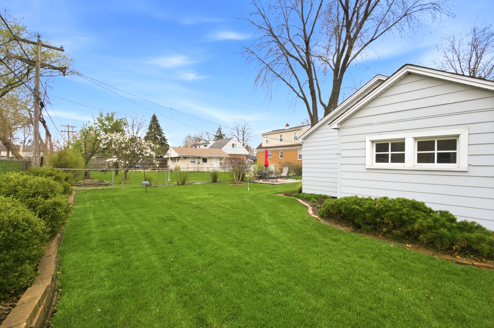 221 South Michigan Avenue Addison, IL 60101 - Photo 24 of 25 a view of a house with a yard