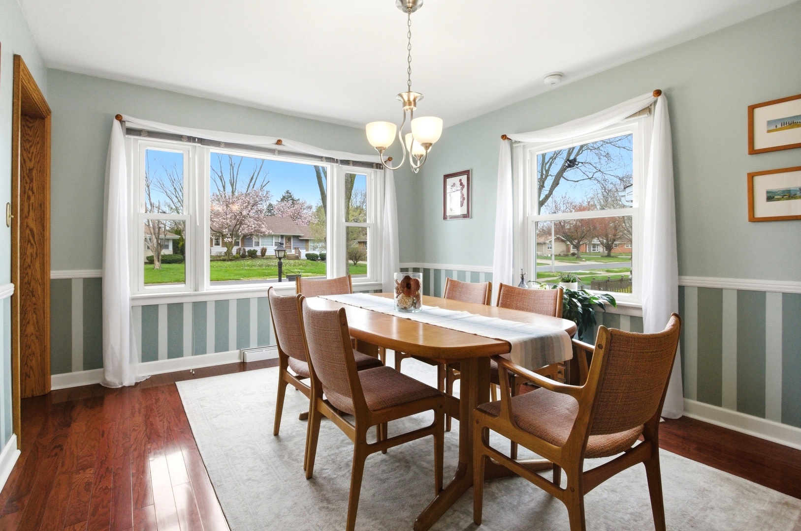 221 South Michigan Avenue Addison, IL 60101 - Photo 6 of 25 a view of a dining room with furniture window and wooden floor
