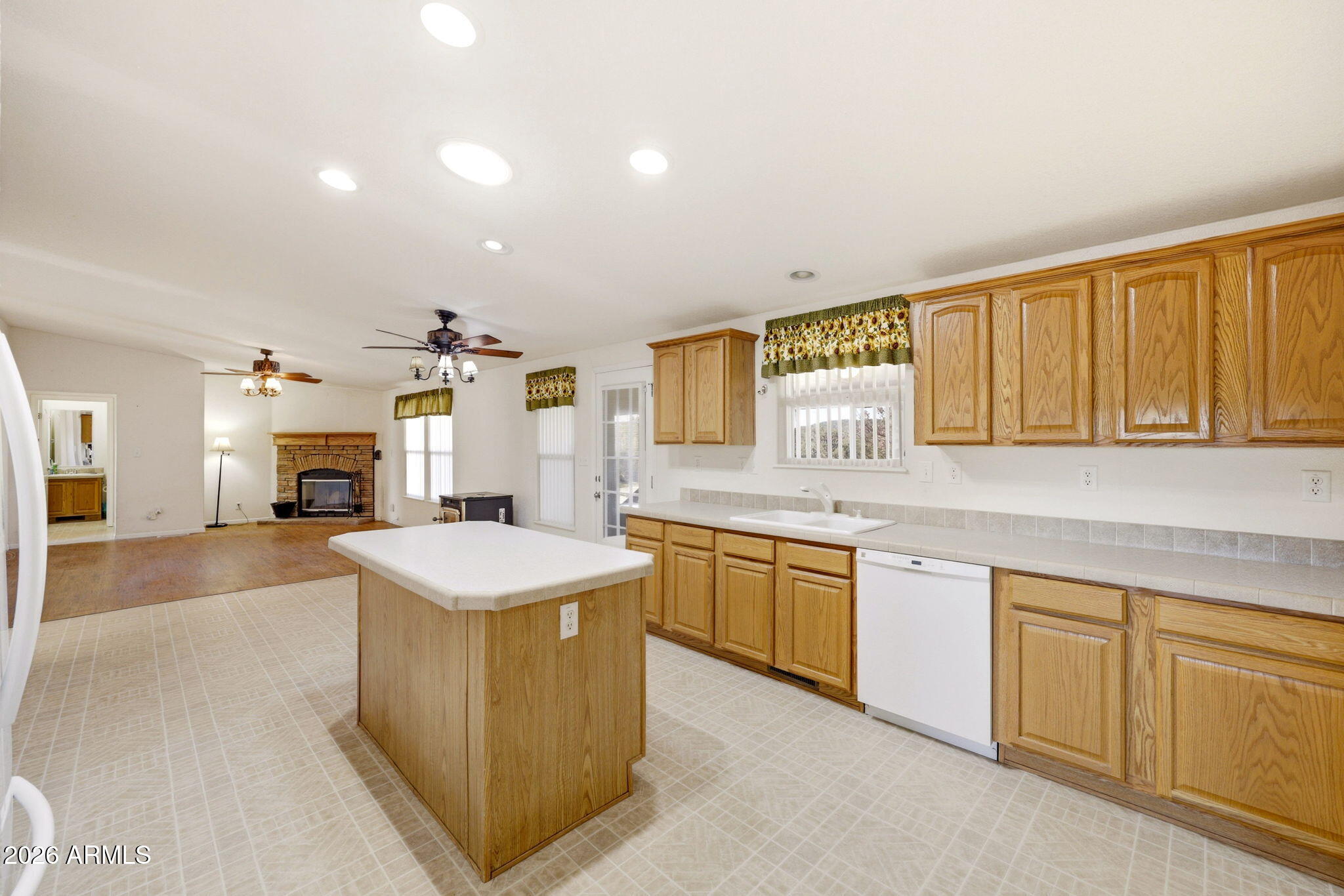 5 County Road Concho, AZ 85924 - Photo 12 of 35 a kitchen with granite countertop a sink dishwasher stove top oven and cabinets with wooden floor
