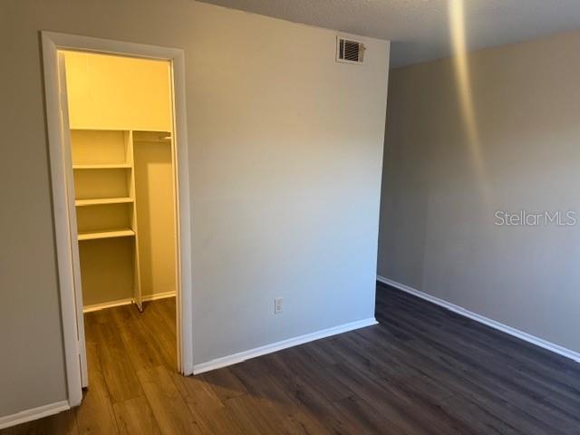 7309 Abonado Road, Unit 7309 Tampa, FL 33615 - Photo 6 of 17 a view of an empty room with wooden floor and a window
