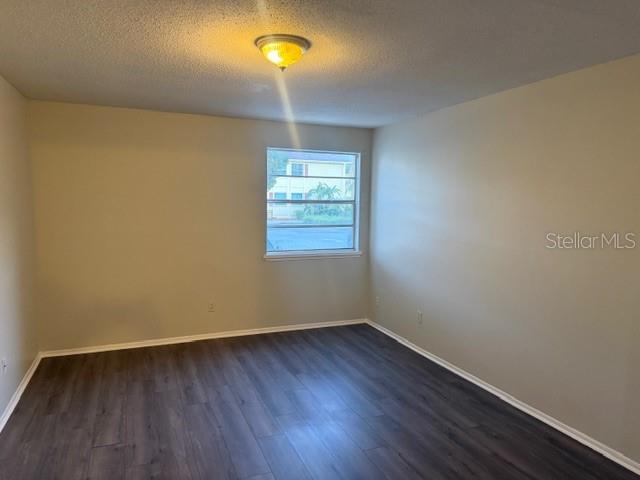 7309 Abonado Road, Unit 7309 Tampa, FL 33615 - Photo 7 of 17 wooden floor in an empty room with a window