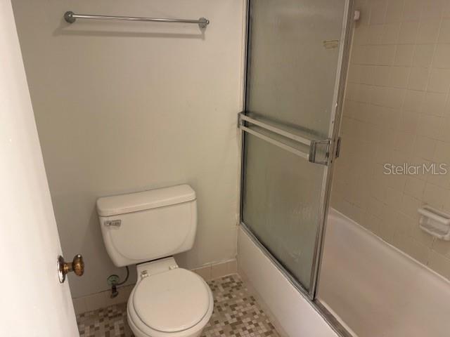 7309 Abonado Road, Unit 7309 Tampa, FL 33615 - Photo 8 of 17 a white toilet sitting next to a shower