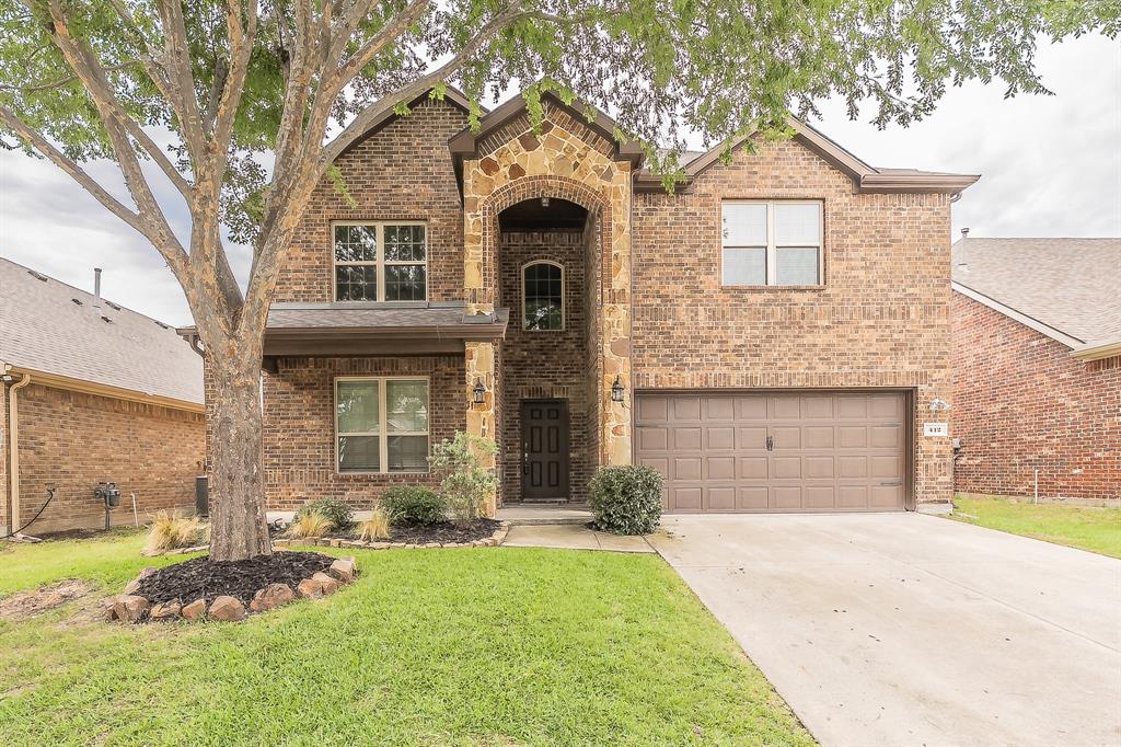 412 Hideaway Road McKinney, TX 75072 - Photo 2 of 40 a front view of a house with a yard and garage