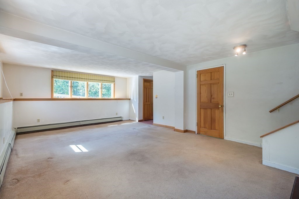 5 Rich Road Woburn, MA 01801 - Photo 17 of 25 an empty room with windows