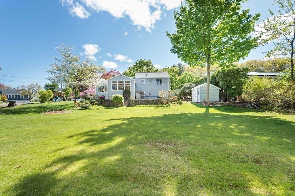 5 Rich Road Woburn, MA 01801 - Photo 25 of 25 a view of a house with a big yard and large trees