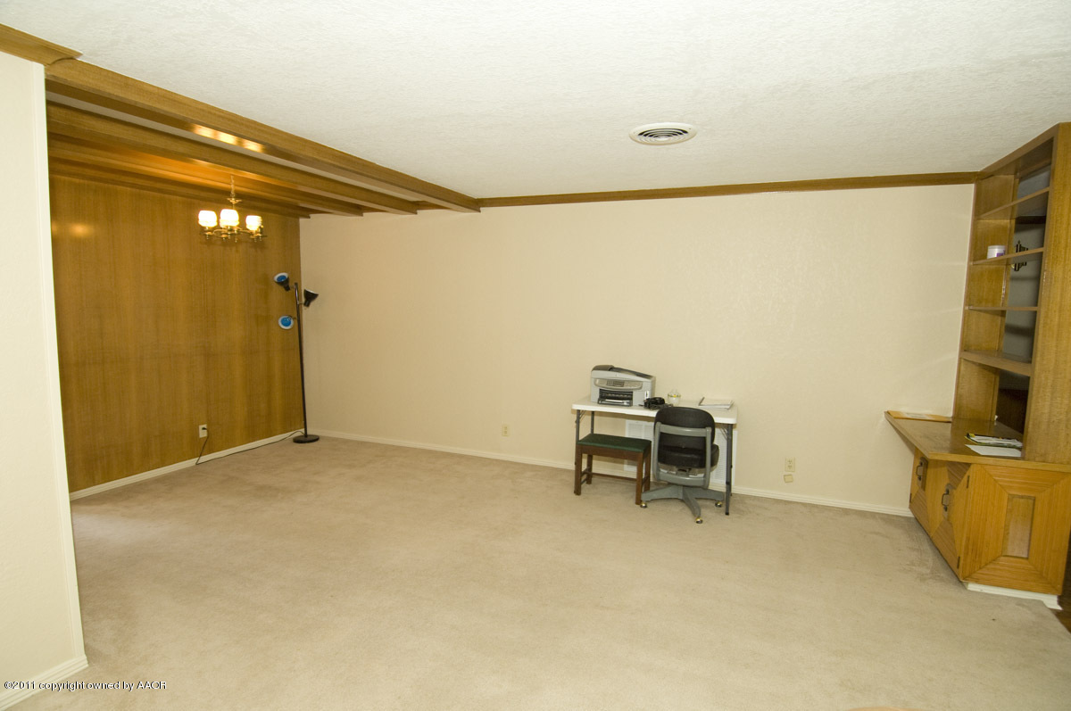1221 South Austin Street Amarillo, TX 79102 - Photo 11 of 28 a view of a room with a table and a chair