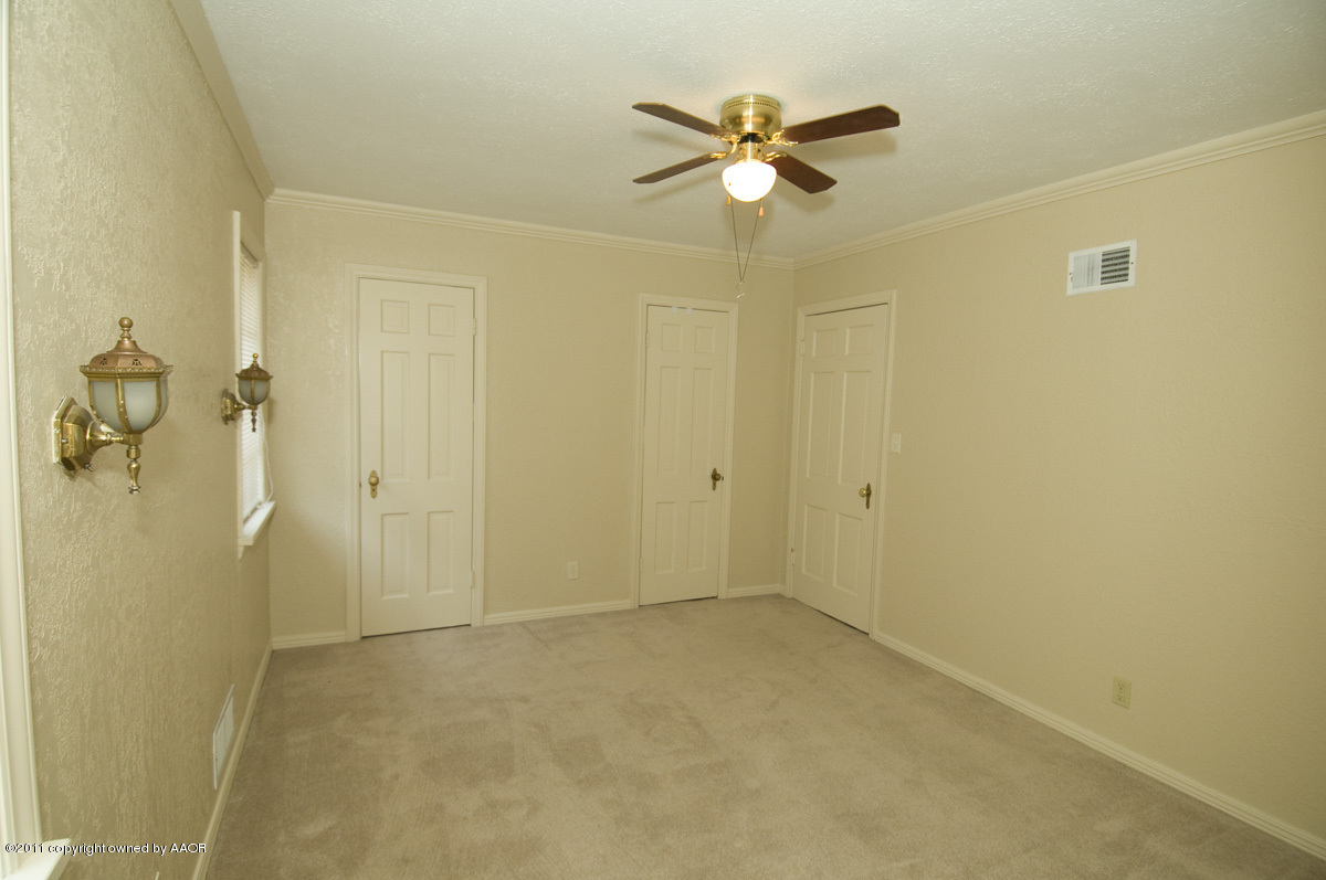 1221 South Austin Street Amarillo, TX 79102 - Photo 12 of 28 a view of a livingroom with a chandelier fan