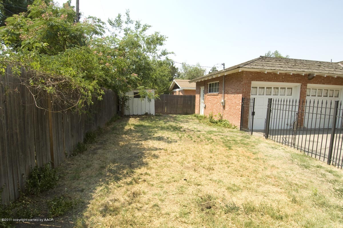 1221 South Austin Street Amarillo, TX 79102 - Photo 28 of 28 a view of a house with a yard and fence
