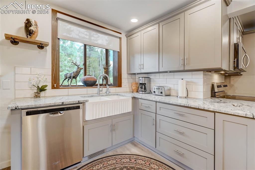 1699 Spring Valley Drive Divide, CO 80814 - Photo 13 of 44 a kitchen with a sink and cabinets