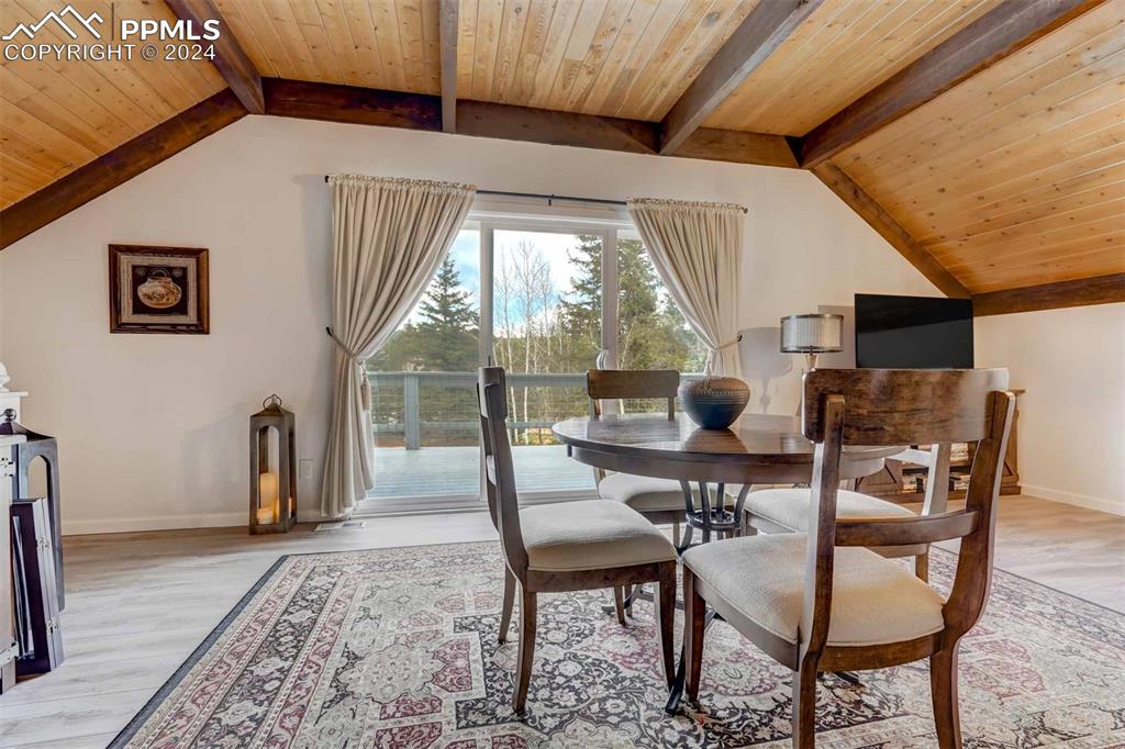 1699 Spring Valley Drive Divide, CO 80814 - Photo 18 of 44 a dining room with furniture and wooden floor
