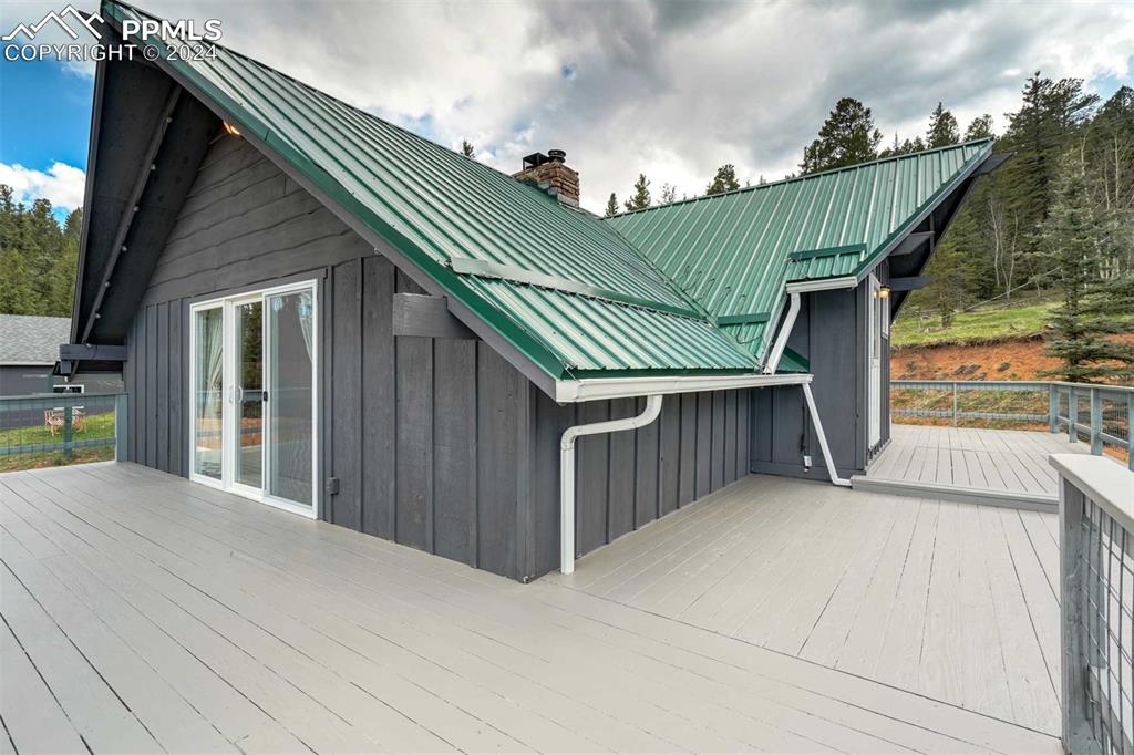 1699 Spring Valley Drive Divide, CO 80814 - Photo 30 of 44 a view of backyard with deck and outdoor seating