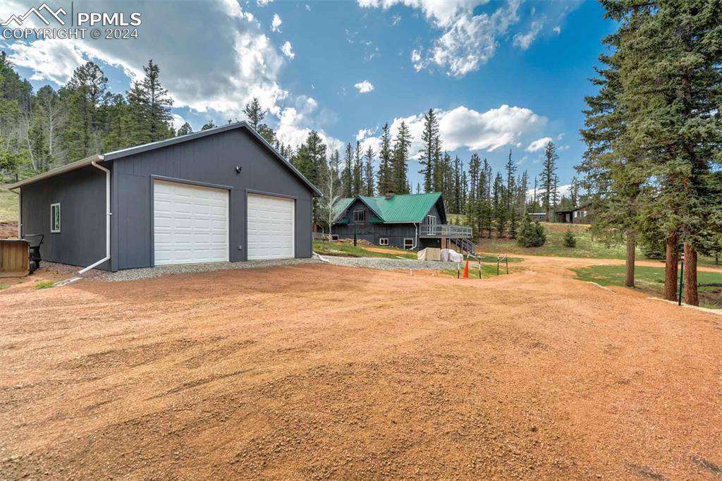 1699 Spring Valley Drive Divide, CO 80814 - Photo 31 of 44 a backyard of a house with table and chairs