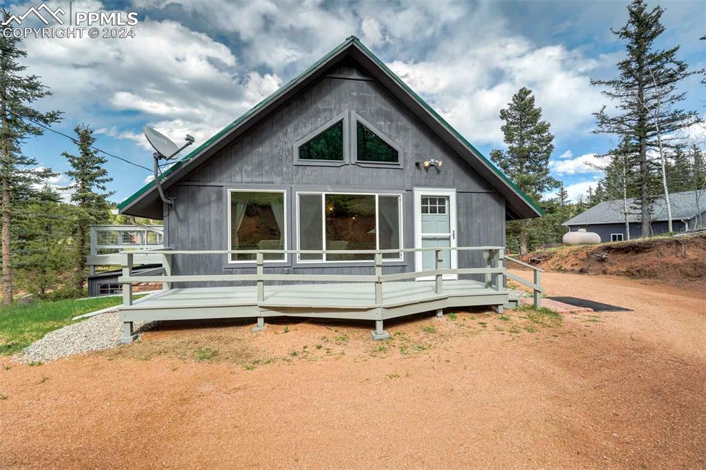 1699 Spring Valley Drive Divide, CO 80814 - Photo 32 of 44 a front view of a house with a yard