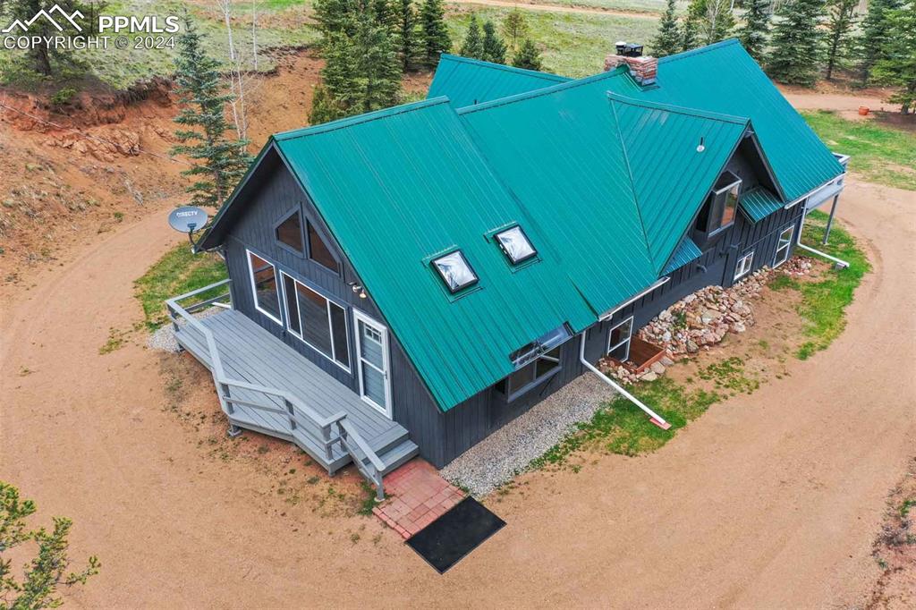 1699 Spring Valley Drive Divide, CO 80814 - Photo 37 of 44 an aerial view of a house with a yard and a garage