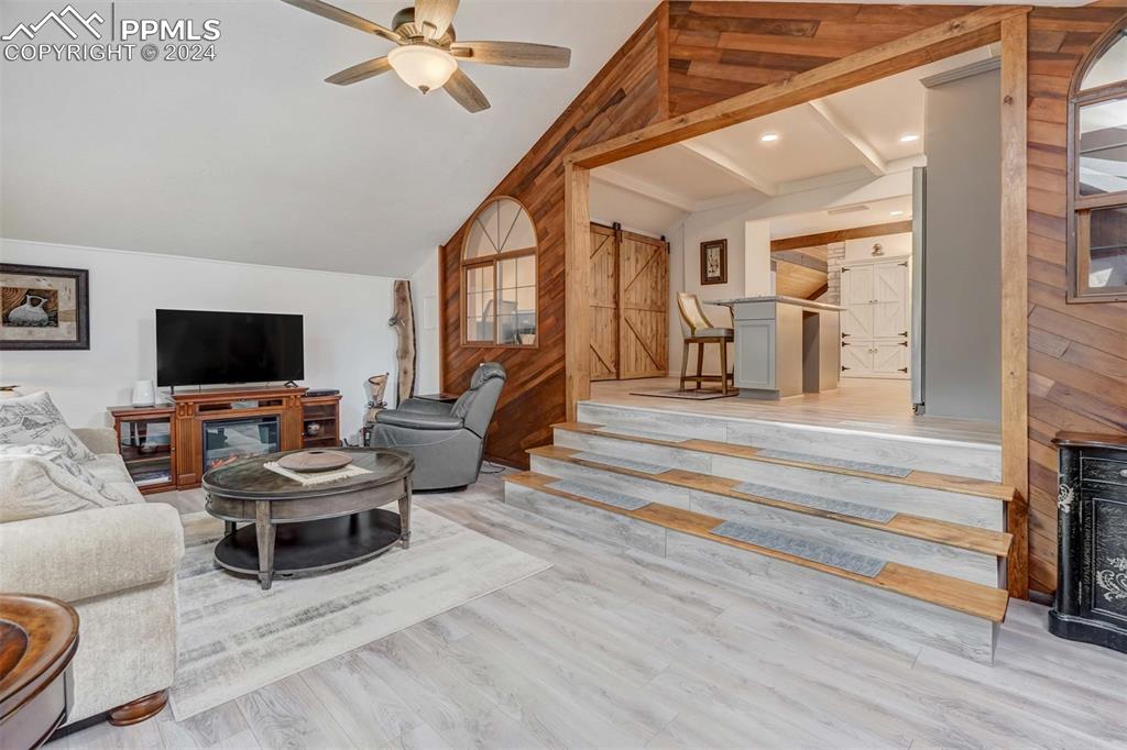 1699 Spring Valley Drive Divide, CO 80814 - Photo 9 of 44 a living room with furniture and a flat screen tv