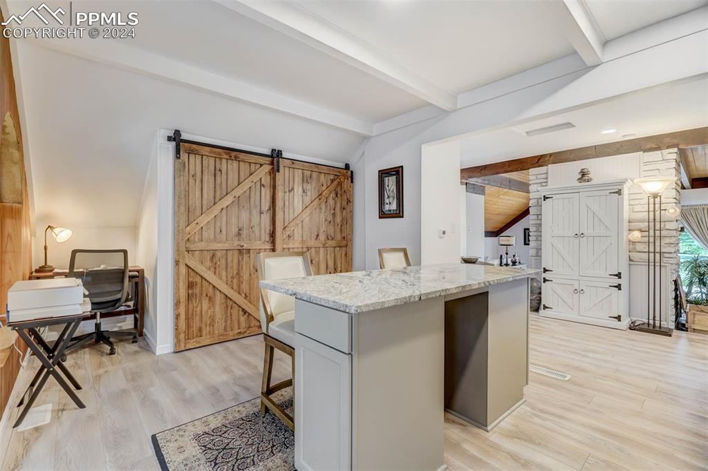 1699 Spring Valley Drive Divide, CO 80814 - Photo 10 of 44 a view of a kitchen area with furniture and wooden floor