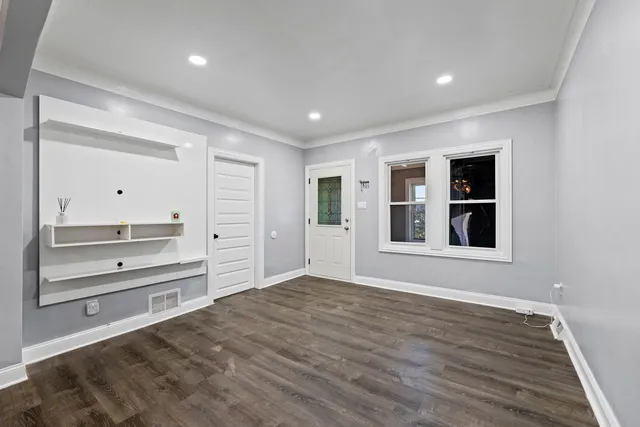 a view of an empty room with a window