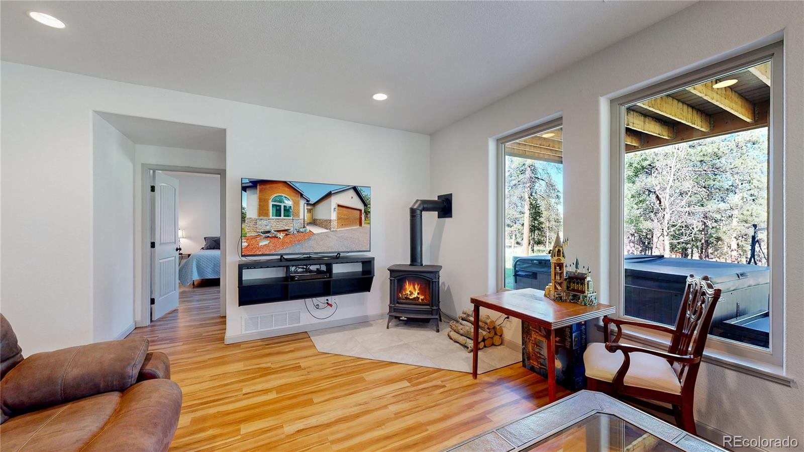 230 Mohawk Trail Pine, CO 80470 - Photo 18 of 39 a living room with furniture and a wooden floor