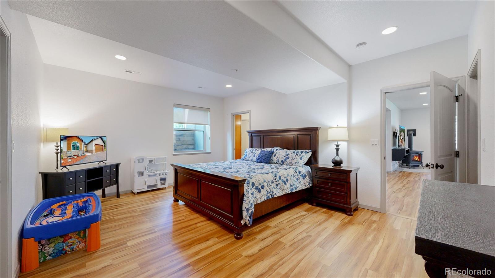 230 Mohawk Trail Pine, CO 80470 - Photo 22 of 39 a bedroom with a bed and dresser