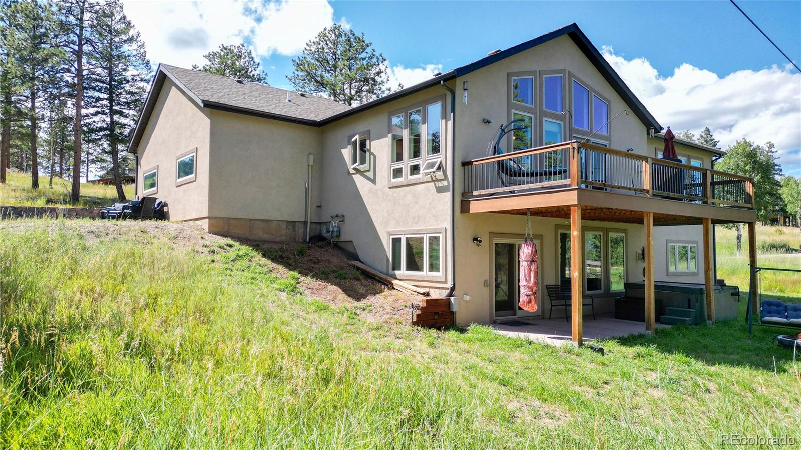 230 Mohawk Trail Pine, CO 80470 - Photo 32 of 39 a front view of a house with a yard