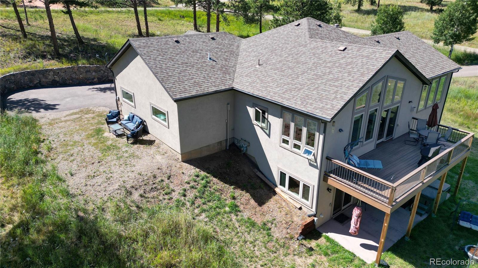 230 Mohawk Trail Pine, CO 80470 - Photo 33 of 39 an aerial view of a house with swimming pool garden and patio