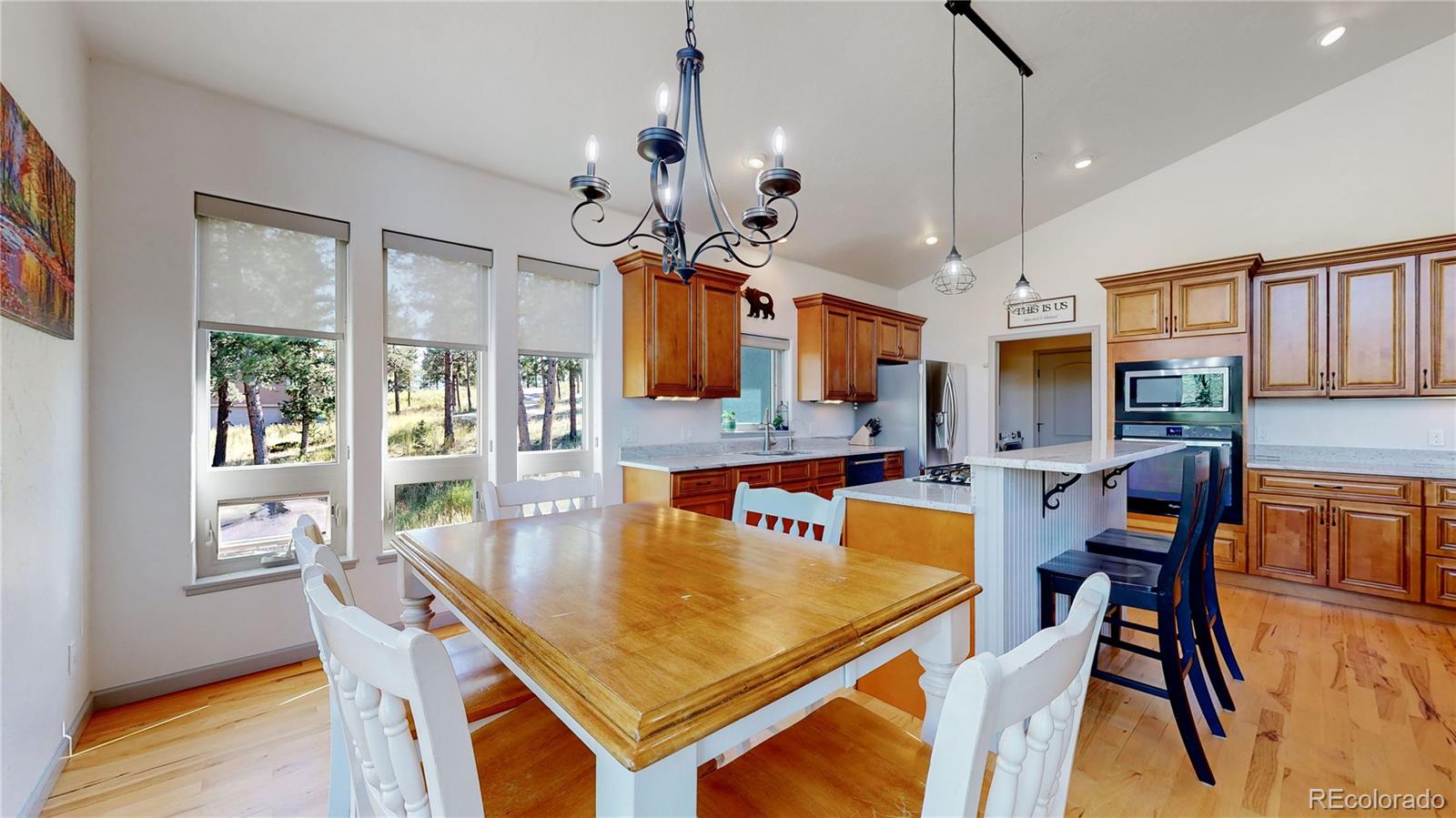 230 Mohawk Trail Pine, CO 80470 - Photo 6 of 39 a view of a dining room with furniture and wooden floor