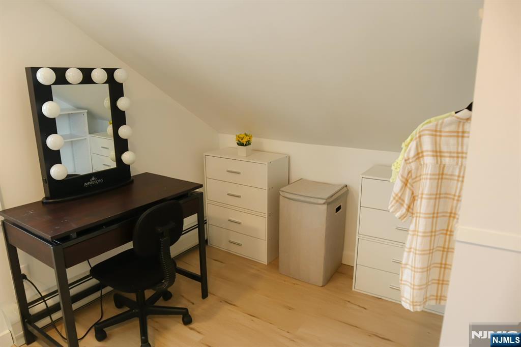 78 Poplar Avenue Little Ferry, NJ 07643 - Photo 13 of 23 a room with a table and a mirror