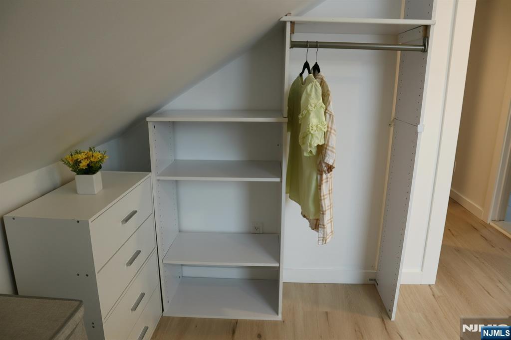 78 Poplar Avenue Little Ferry, NJ 07643 - Photo 14 of 23 a walk in closet with wooden floor
