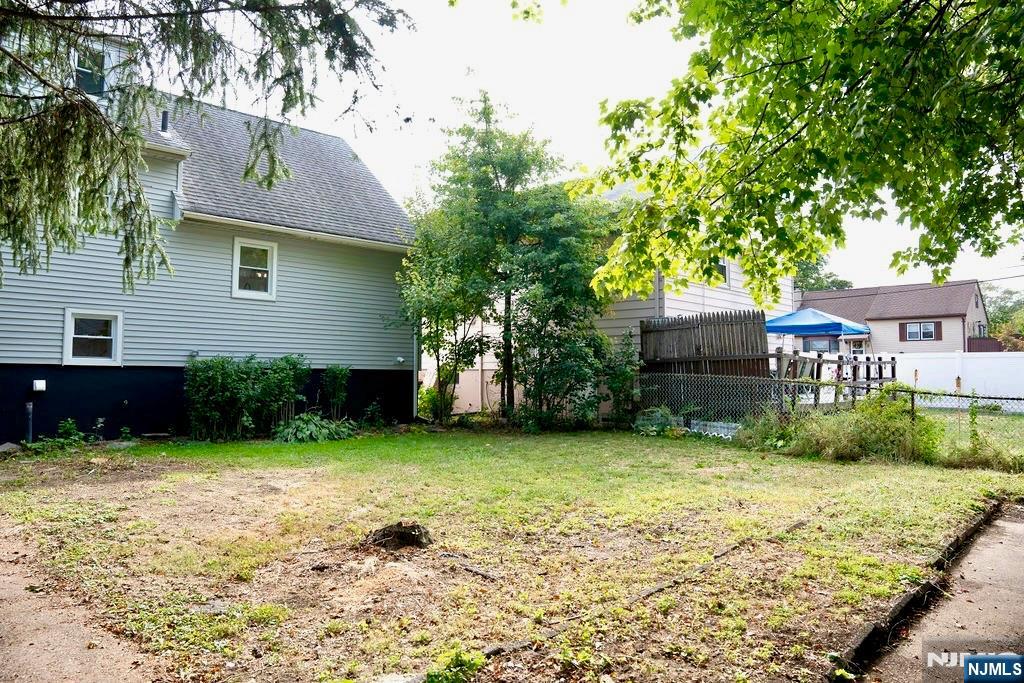 78 Poplar Avenue Little Ferry, NJ 07643 - Photo 20 of 23 a front view of a house with garden