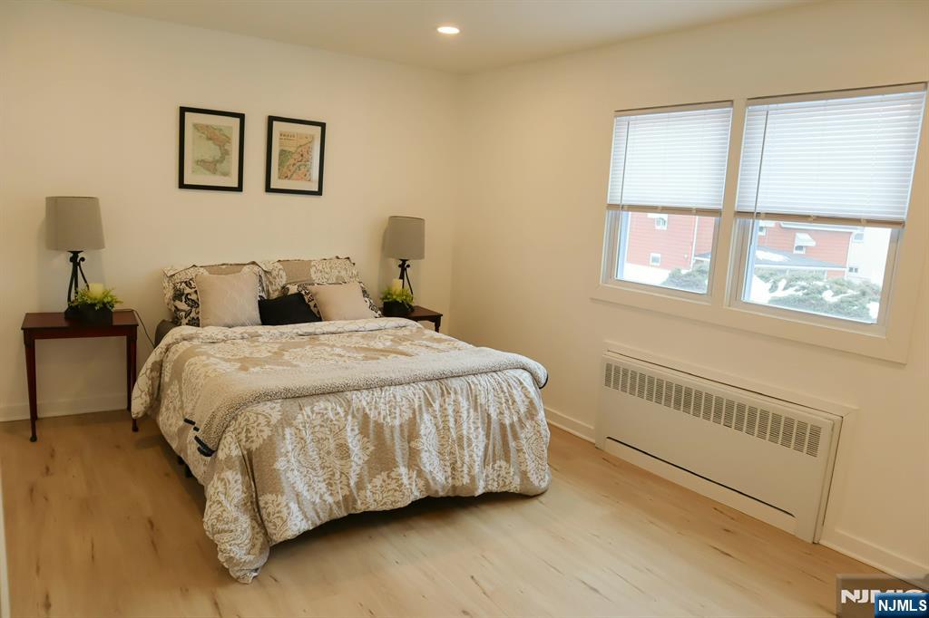 78 Poplar Avenue Little Ferry, NJ 07643 - Photo 4 of 23 a bedroom with a bed and a window