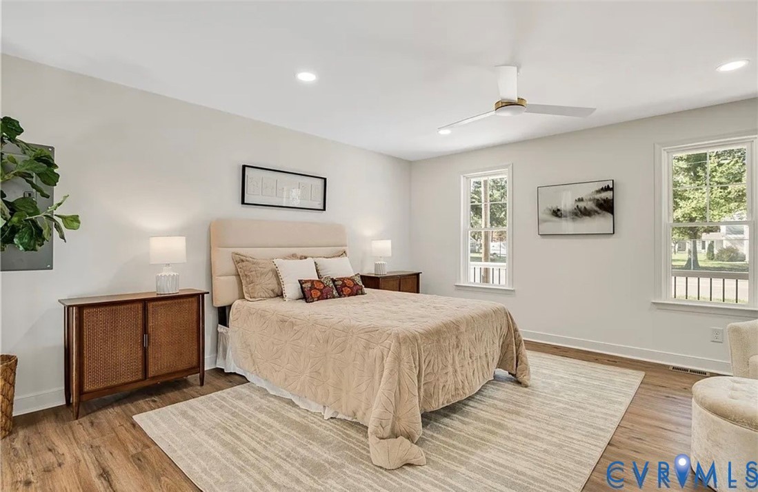 14915 Lebanon Road Spring Grove, VA 23881 - Photo 3 of 6 a bedroom with a bed and a wooden floor