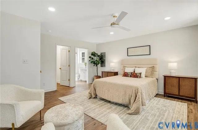 a bedroom with a large bed and a couch